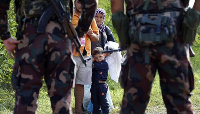 Anger as Hungary seals borders, Merkel demands refugee summit