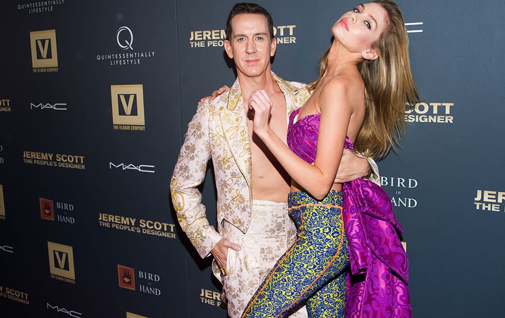 Jeremy Scott, left, and Stella Maxwell attend the premiere of 