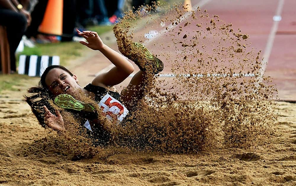 Shraddha Bhaskar Ghule of ONGC on her way to win Gold in Womens Long Jump event during 55th National Open Athletics Championship 2015 in Kolkata.