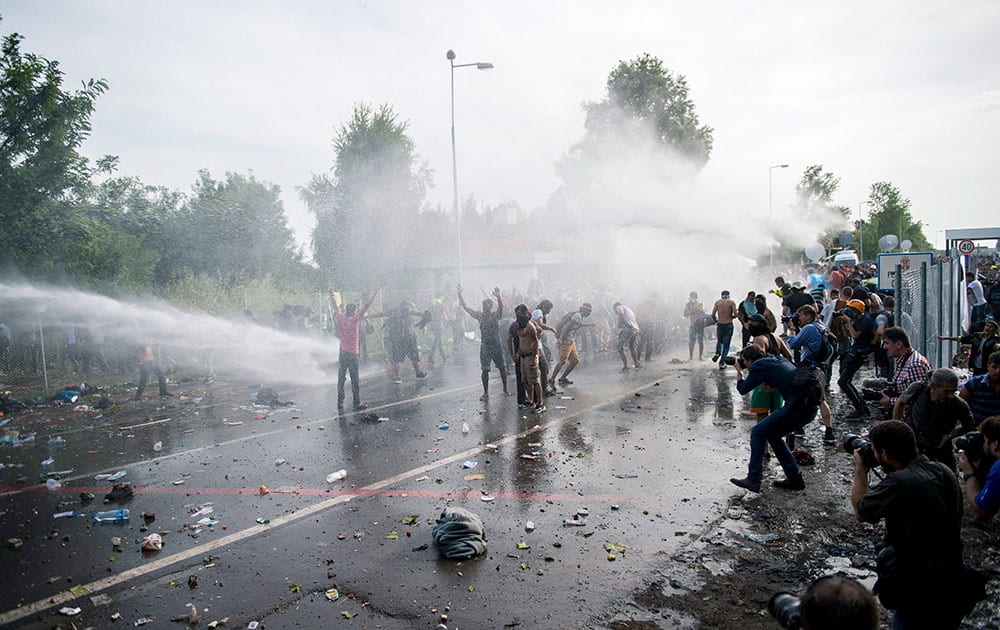 Hungarian police use water canons against migrants at the Horgos 2 border crossing into Hungary, near Horgos, Serbia.