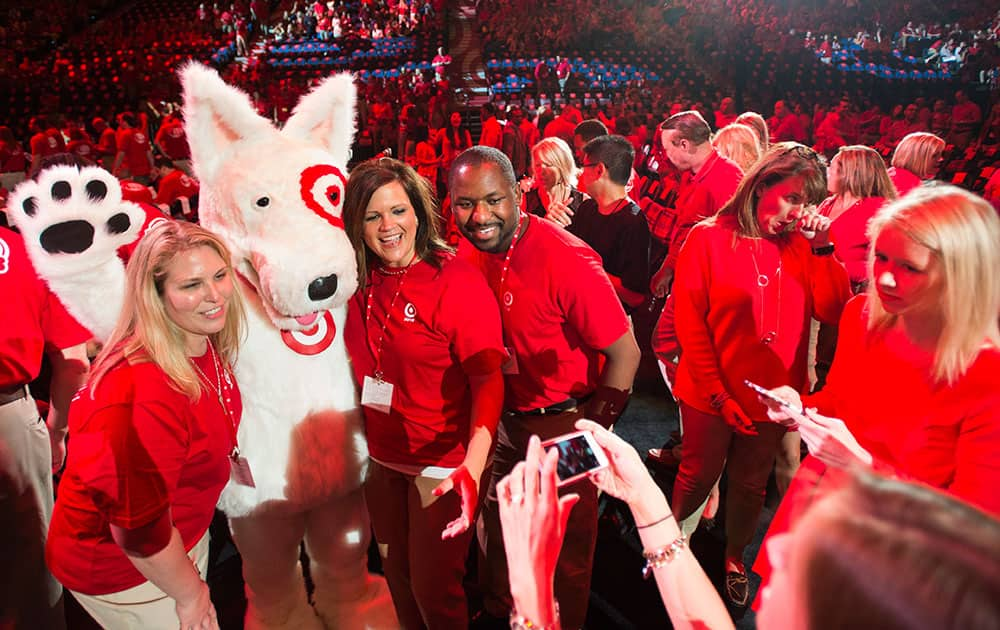 Target employees pose with 'Bullseye' the official mascot of Target Corporation before Target's annual meeting in Minneapolis.