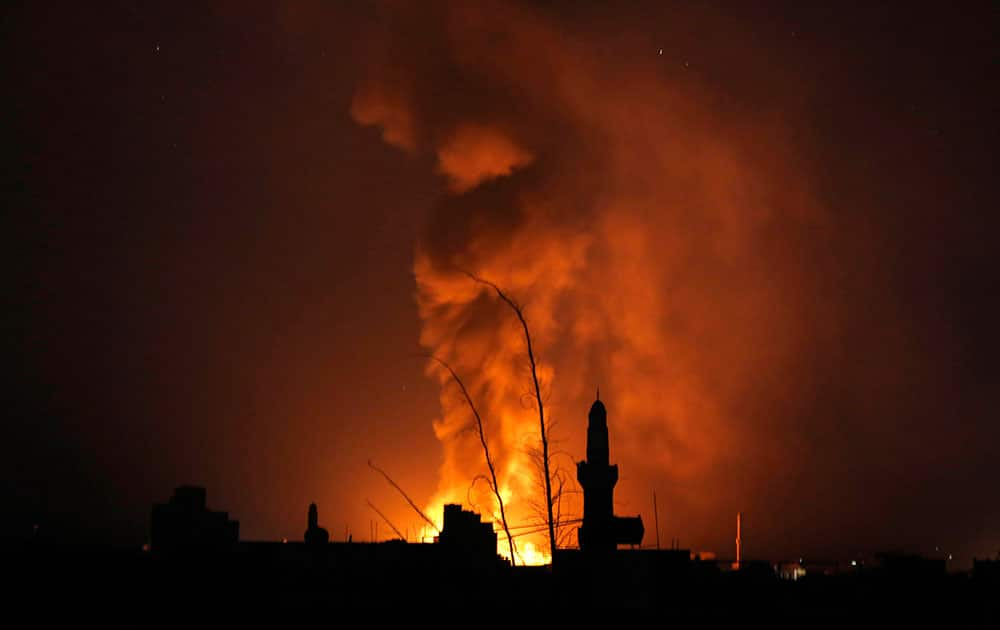 Fire and smoke rise after a Saudi-led airstrike in Sanaa, Yemen.