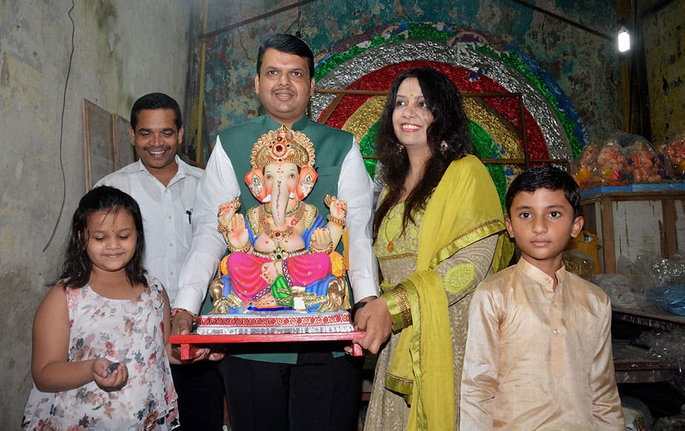 Maharashtra CM Devendra Fadnavis with his family during the Ganpati festival in Mumbai.