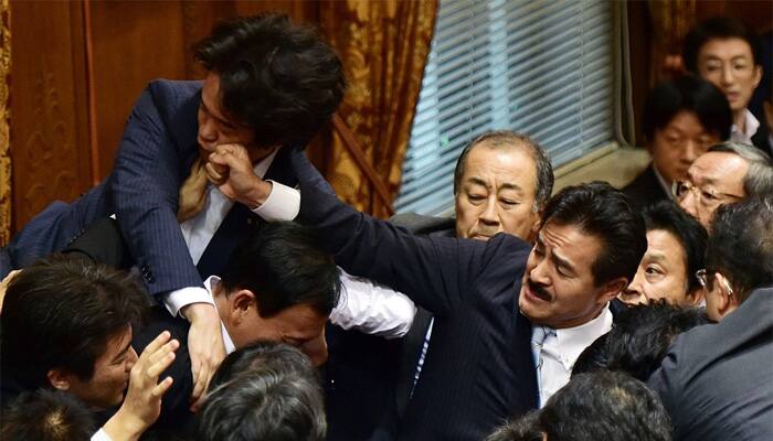 Watch: Japanese lawmakers punch each other during debate in Parliament