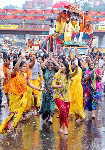 Hindu devotees dance at a procession during the ongoing Kumbh Mela in Nashik.