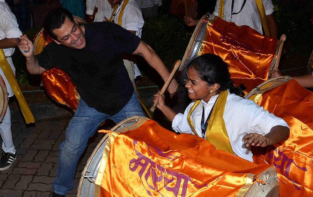 Bollywood actor Salman Khan dances during Ganesh festival at his residence in Mumbai.