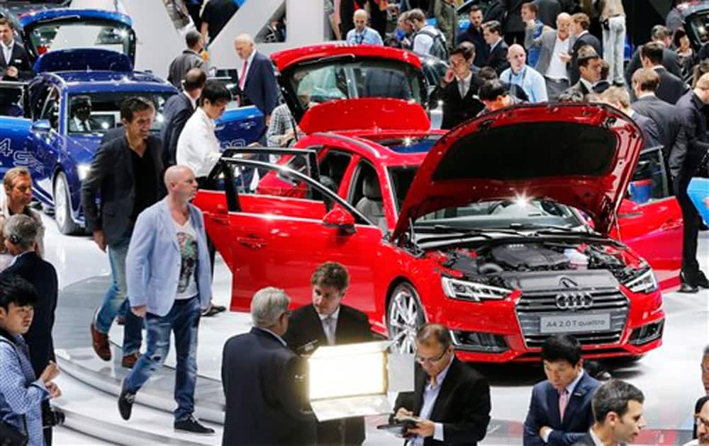Visitors walk around an Audi Quattro on the second press day of the Frankfurt Auto Show IAA in Frankfurt, Germany.