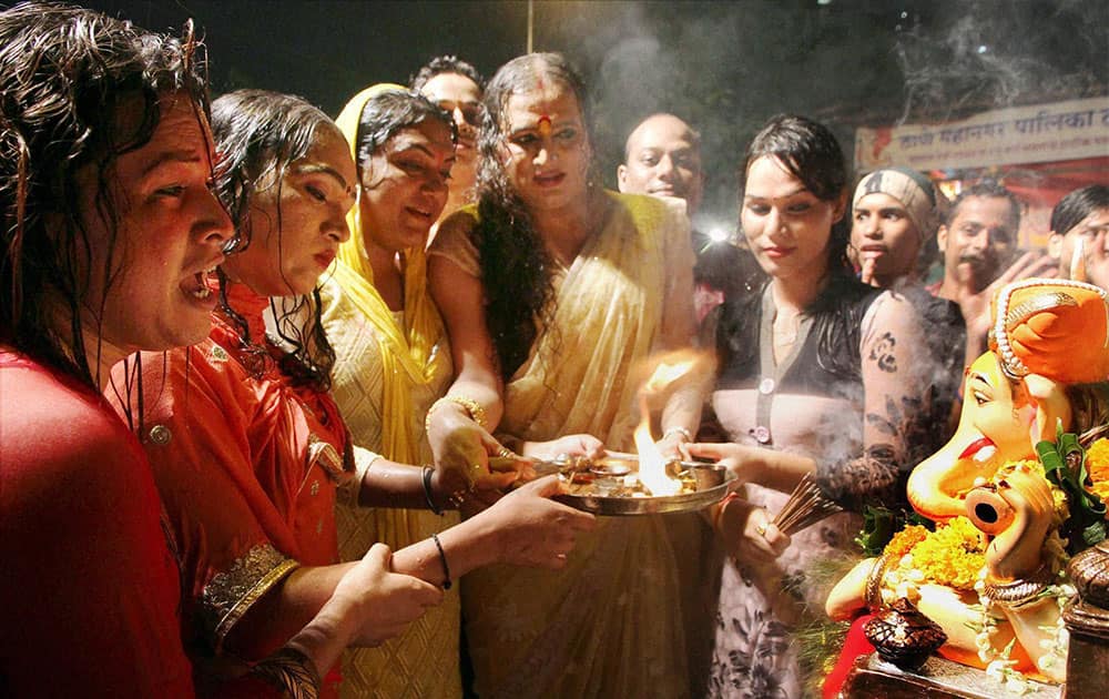 Transgender Laxmi Narayan Tripathi perform worship of Lord Ganesha during a Ganapati Visarjan procession in Thane, Mumbai.