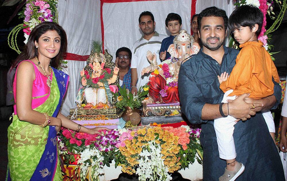 Bollywood actress Shilpa Shetty with husband Raj Kundra and son during Ganapati Visarjan procession in Mumbai.