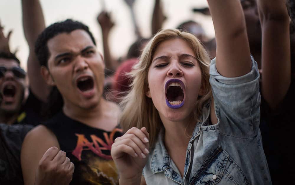 Rock fans yell during the Angra show at the Rock in Rio music festival in Rio de Janeiro, Brazil