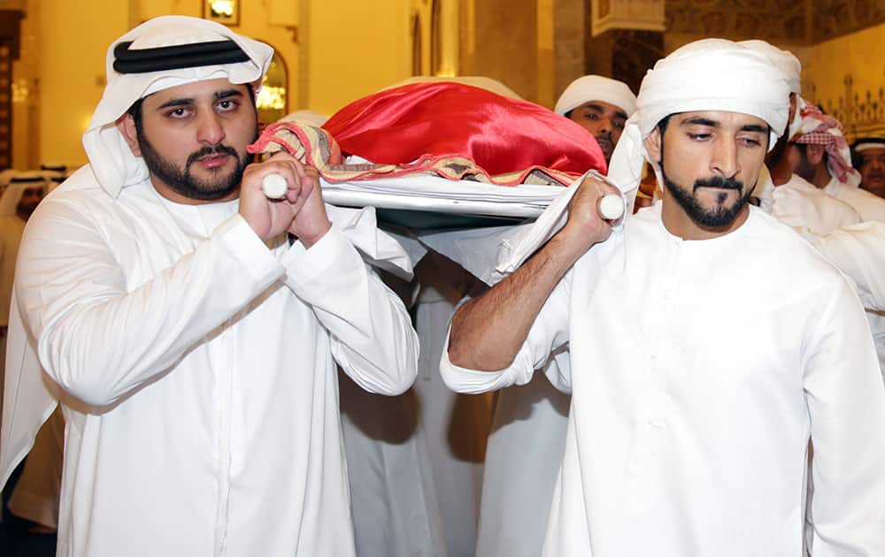 Crown Prince of Dubai Sheikh Hamdan bin Mohammed, right, and the Emirate's Deputy Ruler Sheikh Maktoum bin Mohammed, carry the body of their late brother Sheikh Rashid bin Mohammed bin Rashid Al Maktoum during his funeral prayers at Zabeel Mosque in Dubai, United Arab Emirates. Sheikh Rashid, a son of Dubai's ruler and elder brother to the emirate's heir apparent, has died at age 33. 
