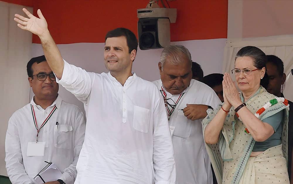Congress President Sonia Gandhi with party Vice President Rahul Gandhi during the Kisan Samman rally at Ramlila Maidan in New Delhi.