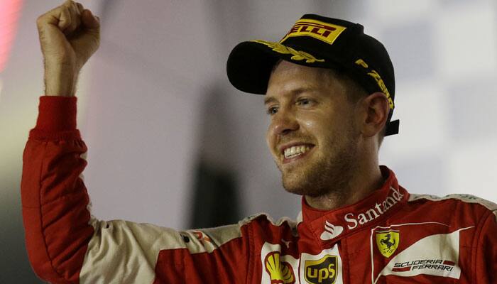 Sebastian Vettel recovers from heart-stopping track invasion to win Singapore Grand Prix