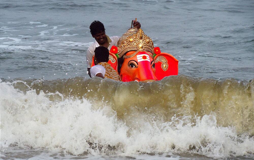 Devotees immersing an idol of Lord Ganesha in the sea, after the Vinayaka Chaturthi festival in Chennai.