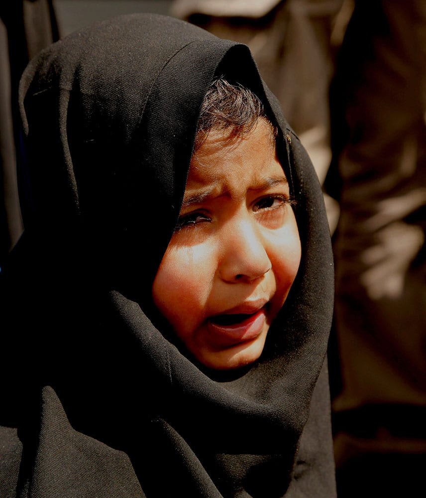 A Kashmiri girl cries during a protest against the killing of a 3-year-old boy, in Srinagar, India.