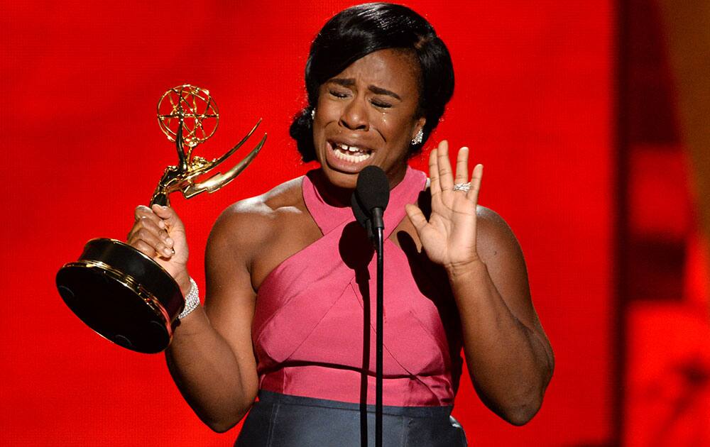 Uzo Aduba accepts the award for outstanding supporting actress in a drama series for “Orange Is The New Black” at the 67th Primetime Emmy Awards.