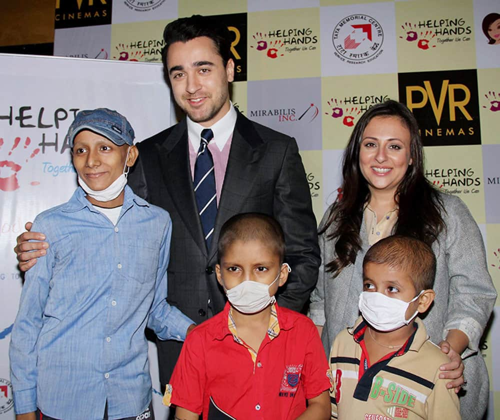 Bollywood Actor Imran Khan along with his wife Avantika Khan with cancer patients during the special screening of his film Katti Batti in Mumbai.