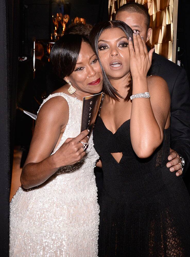 Regina King, left, and Taraji P. Henson pose backstage at the 67th Primetime Emmy Awards.