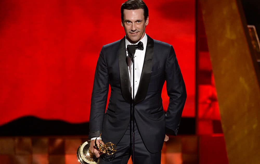 Jon Hamm accepts the award for outstanding lead actor in a drama series for “Mad Men” at the 67th Primetime Emmy Awards.