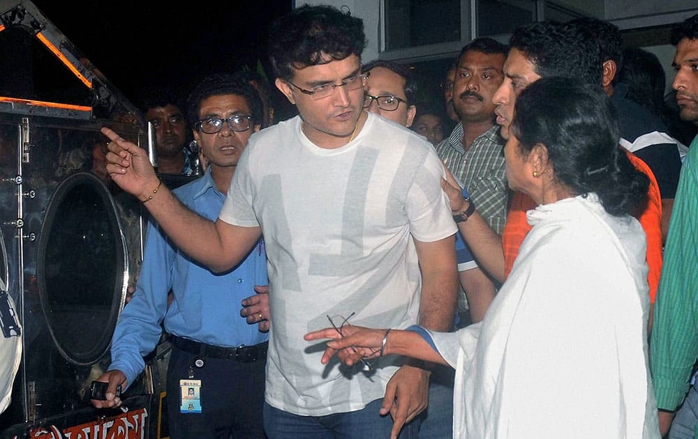 West Bengal Chief Minister Mamata Banerjee with former Indian cricket captain Sourav Ganguly at a private hospital where BCCI President Jagmohan Dalmiya passed away, in Kolkata.