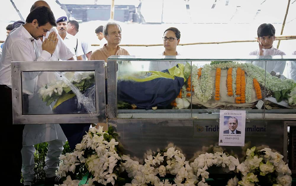 The Board of Control for Cricket in India (BCCI) Secretary Anurag Thakur pays tribute to the body of Jagmohan Dalmiya, in glass casket, BCCI president and former International Cricket Council chief during his funeral in Kolkata.