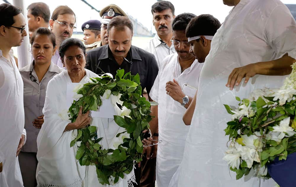 Chief Minister of West Bengal state Mamata Banerjee arrives to pay tribute to Jagmohan Dalmiya, Board of Control for Cricket in India (BCCI) president and former International Cricket Council chief, during his funeral in Kolkata.