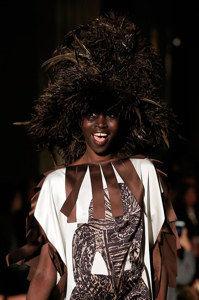 Model Alek Wek displays a creation, part of the Giles Spring/Summer 2016 collection show, during London Fashion Week.