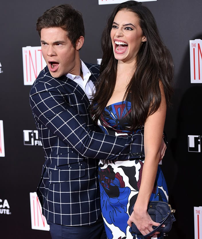 Actors Adam Devine and girlfriend Chloe Bridges attend the premiere of 