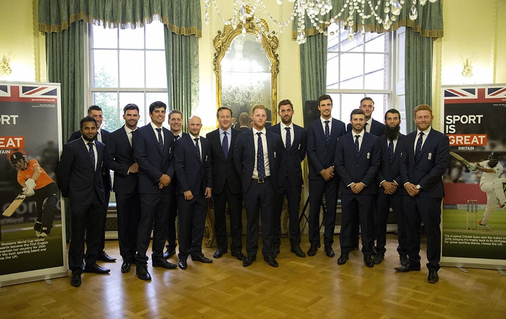 British Prime Minister David Cameron poses for a group shot with the England cricket team during a reception to mark a successful summer of cricket at 10 Downing Street..