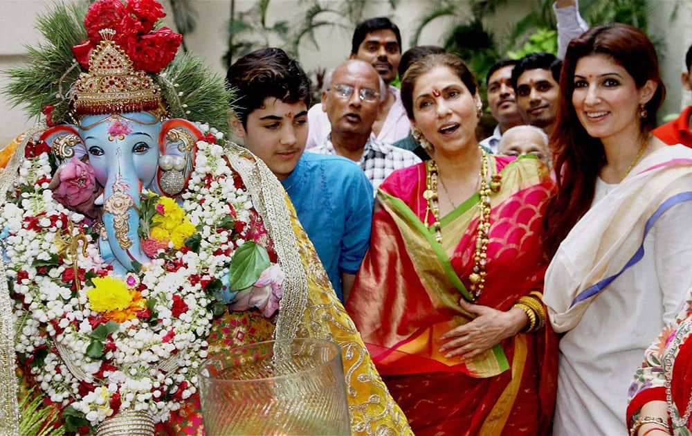 Dimple Kapadia with daughter Twinkle Khanna and Akshay Kumar's son Aarav at their residence during Ganesh Festival in Mumbai.