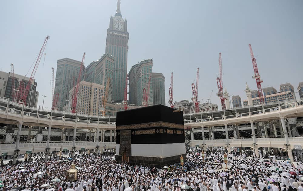 Muslim pilgrims circle the Kaaba, the cubic building at the Grand Mosque in the Muslim holy city of Mecca, Saudi Arabia.