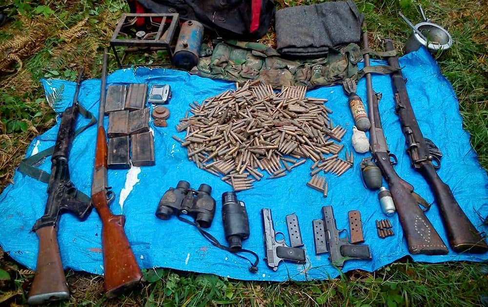 Security Forces recover arms and ammunition from a militants hide out in Gubbar forests in Doda.