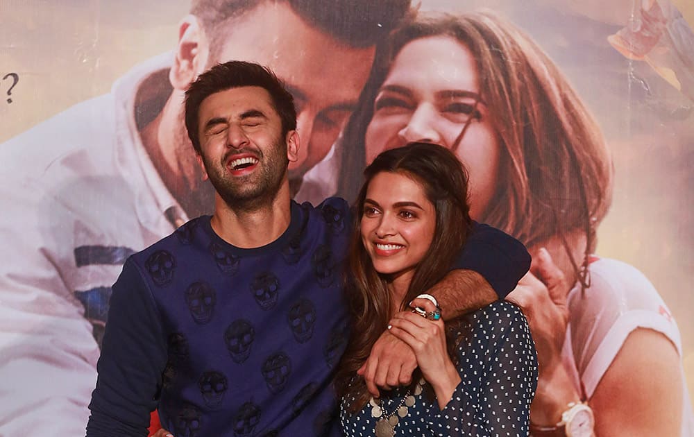 Bollywood actors Ranbir Kapoor left, and Deepika Padukone share a light moment during the trailer launch of their film 'Tamasha' in Mumbai, India.