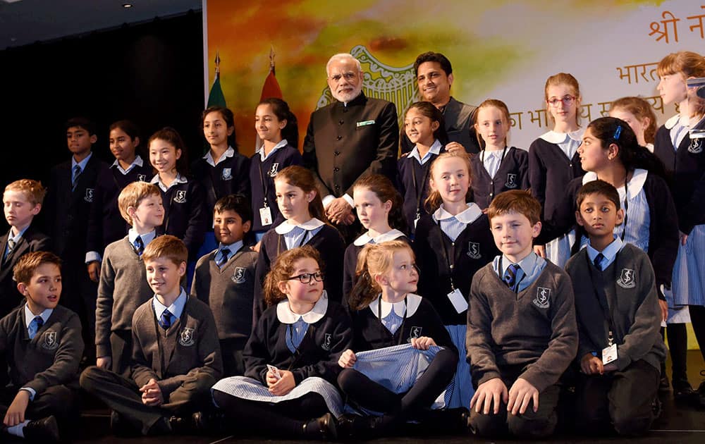 Prime Minister Narendra Modi at a group photo with the children who performed during an interaction with the Indian community people in Dublin.