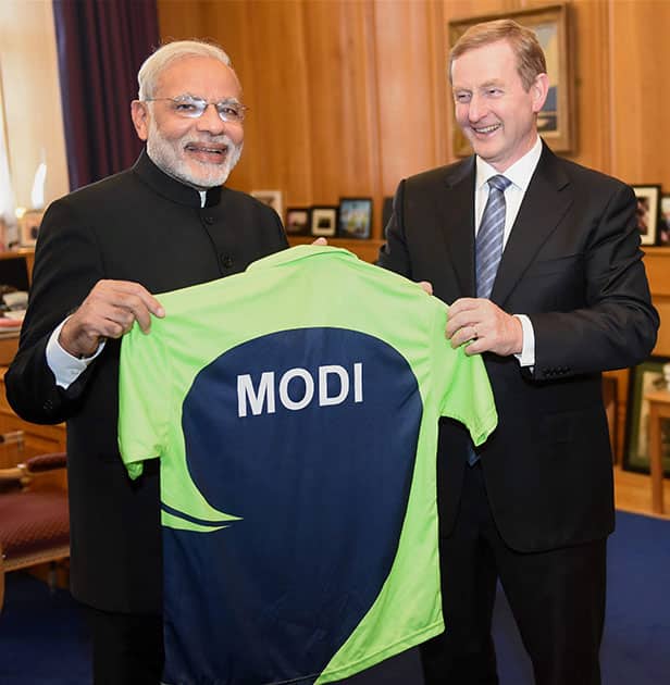 Prime Minister Narendra Modi being presented with a jersey by his Irish counterpart Enda Kenny at a meeting in Dublin.
