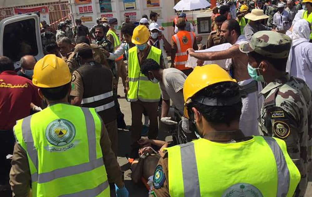 In this image posted on the official Twitter account of the directorate of the Saudi Civil Defense agency, rescuers respond to a stampede that killed and injured pilgrims in the holy city of Mina during the annual hajj pilgrimage.