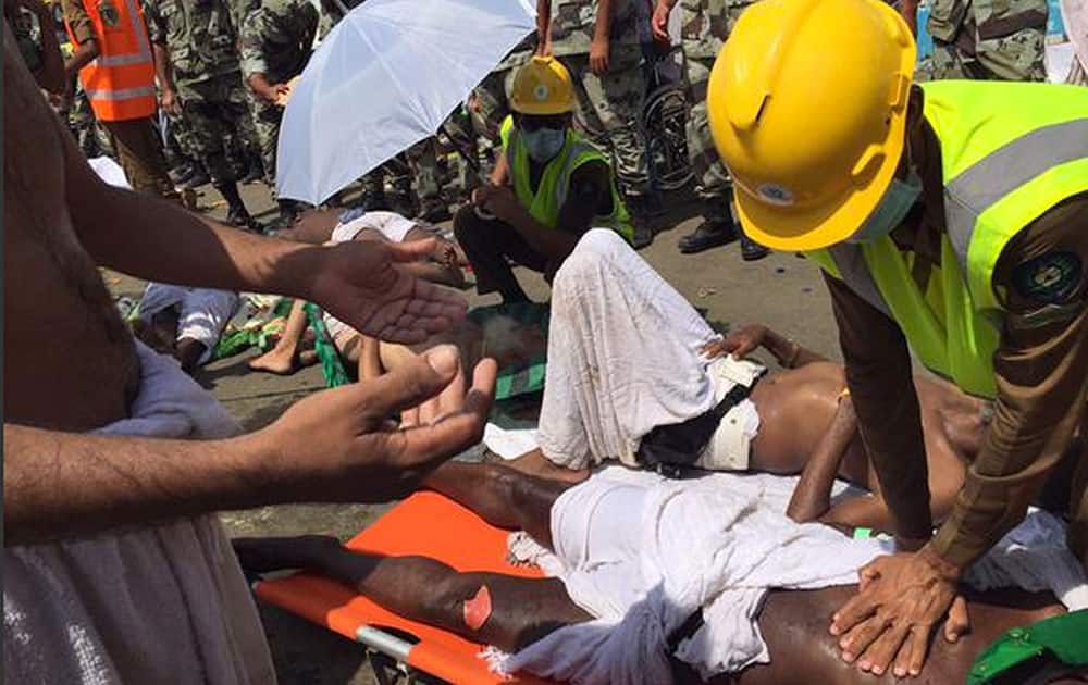 In this image posted on the official Twitter account of the directorate of the Saudi Civil Defense agency, a pilgrim is treated by a medic after a stampede that killed and injured pilgrims in the holy city of Mina during the annual hajj pilgrimage.