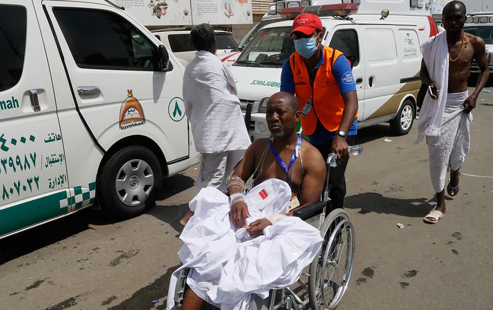 A rescue worker attends to a man injured in Mina, Saudi Arabia during the annual hajj pilgrimage.