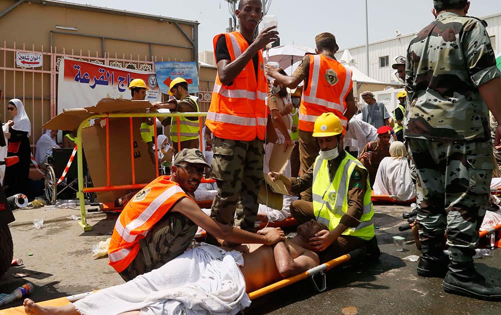 Rescue workers attend to victims of a stampede in Mina, Saudi Arabia during the annual hajj pilgrimage. Hundreds were killed and injured, Saudi authorities said. 