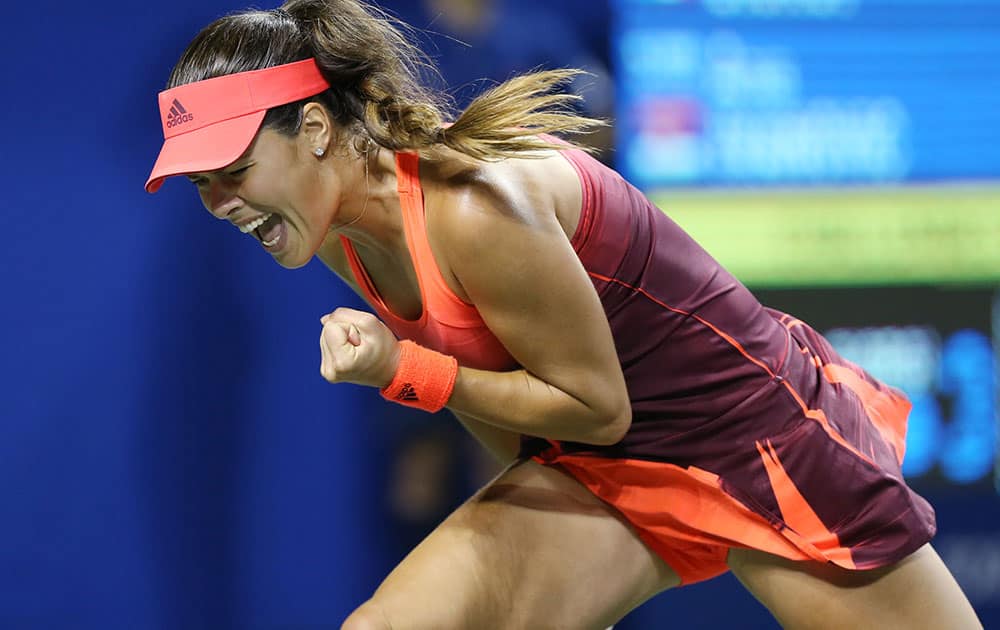 Ana Ivanovic of Serbia reacts as she won a point against Camila Giorgi of Italy during the second round of the Pan Pacific Open women’s tennis tournament in Tokyo.