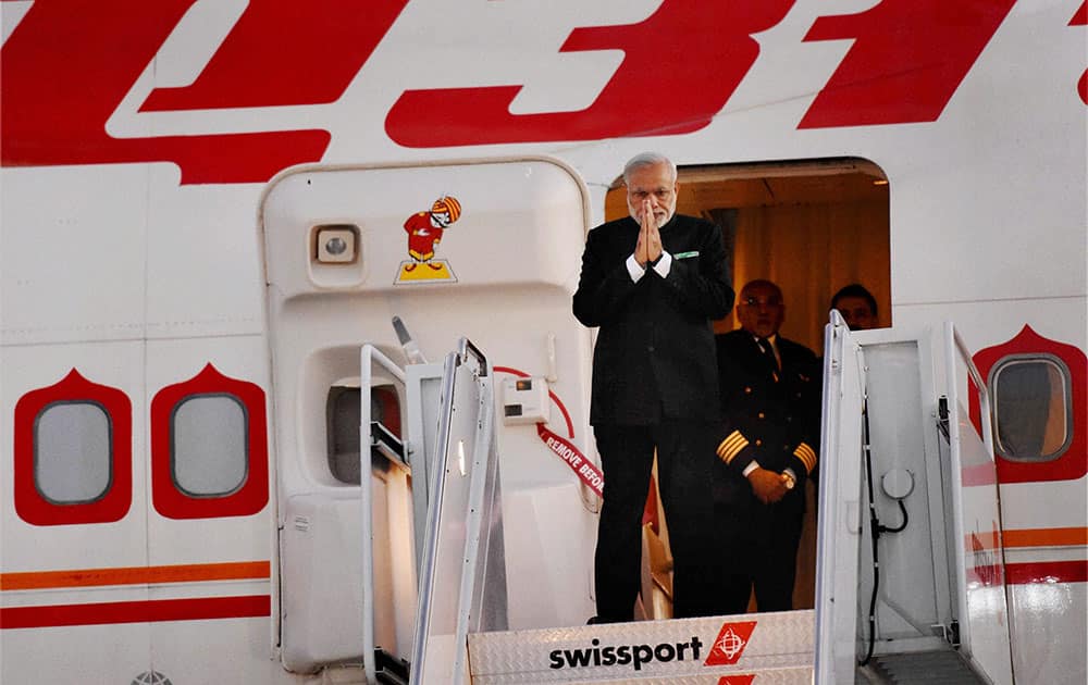 Prime Minister Narendra Modi gestures upon his arrival at John F Kennedy International Airport in New York.