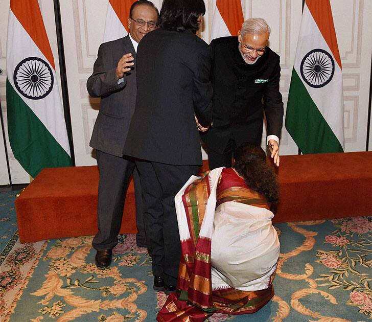 Prime Minister Narendra Modi gives blessing to a member of Gujarati community in New York.