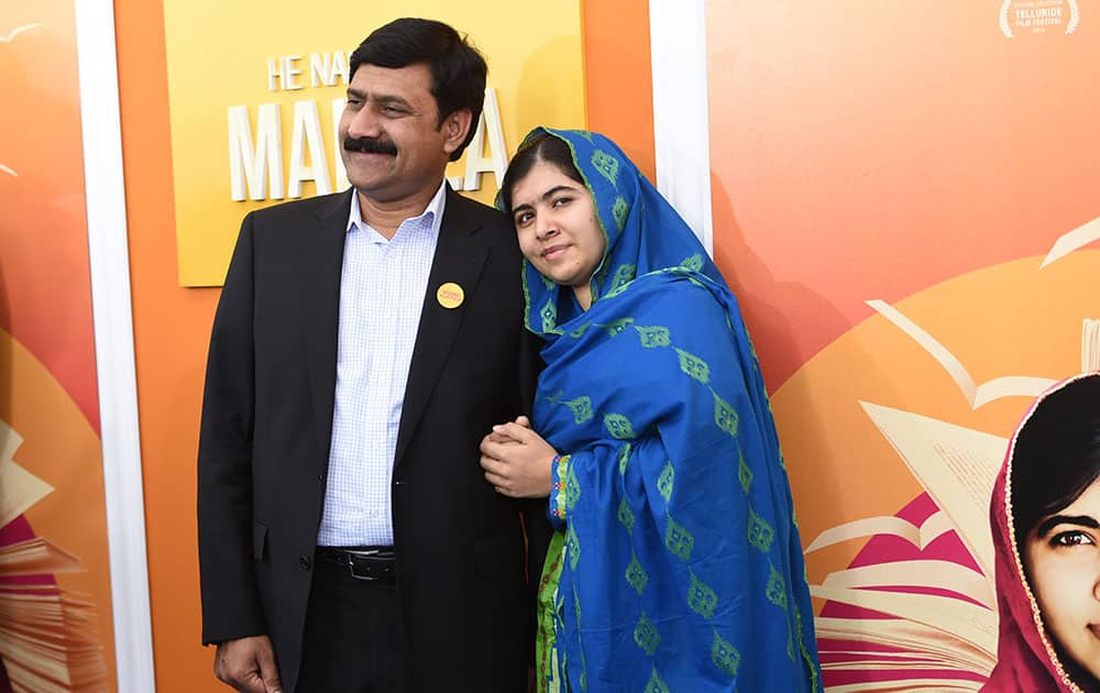 Ziauddin Yousafzai and Malala Yousafzai attend the premiere of 