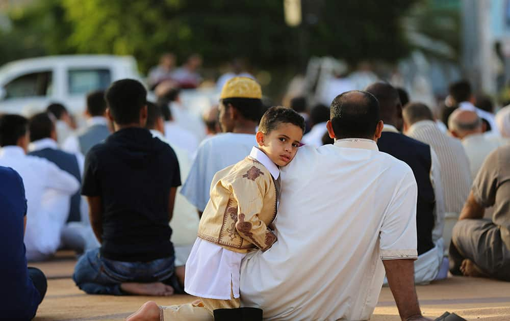 Worshipers attend a sermon during Eid al-Adha at the Martyrs Square in central Tripoli, Libya.