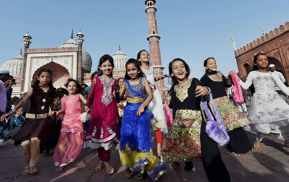 Muslim children jubilate at Jama Masjid on the occasion of Eid al-Adha at Jama Masjid in New Delhi.