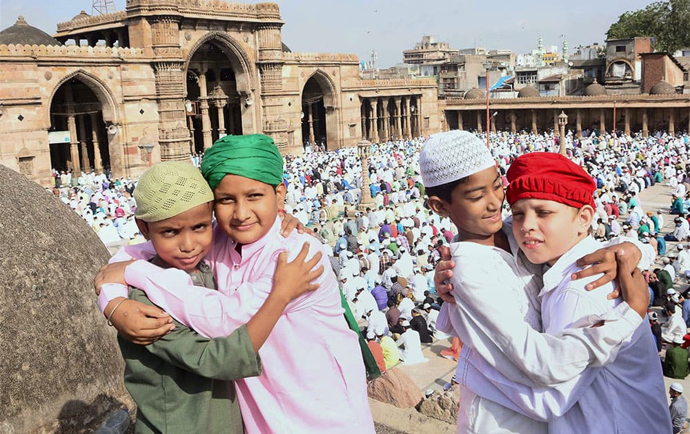 Children greeting each other after offering prayers on the ocasion of Eid-al-Adha at Jama Masjid in Ahmedabad.