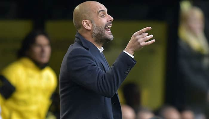 Bayern Munich coach Pep Guardiola walks out of press briefing