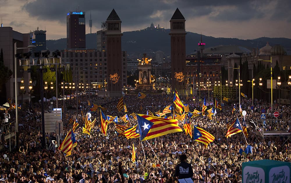 Pro independence supporters wave 'estelada' or pro independence flags during a rally of 'Junts pel Si' or 'Together for YES' in Barcelona, Spain.