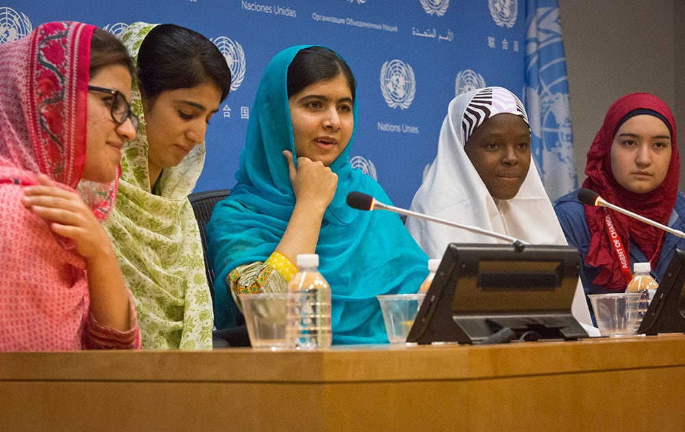 Nobel Peace Prize winner Malala Yousafzai, hold a press conference with her friends and youth activists Shazia Ramzan and Kainat Riaz, second from left, both from Pakistan, Amina Yusuf from Nigeria, second from right, and Salam Masri from Syria, at United Nations headquarters.