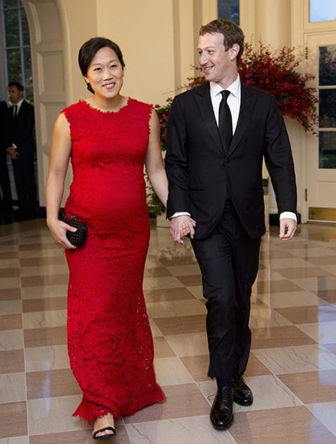 Facebook Chairman and Chief Executive Officer Mark Zuckerberg and his wife Priscilla Chan, arrive for a State Dinner in honor of Chinese President Xi Jinping, in the East Room of the White House in Washington.